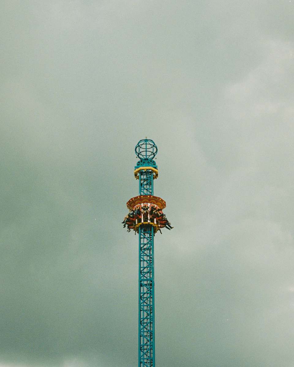 amusement park people riding tower amusement park ride sydney nsw